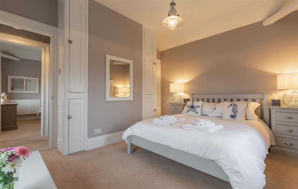 Bedroom with 5’ king-size bed at Khina Cottage, North Foreland Lighthouse