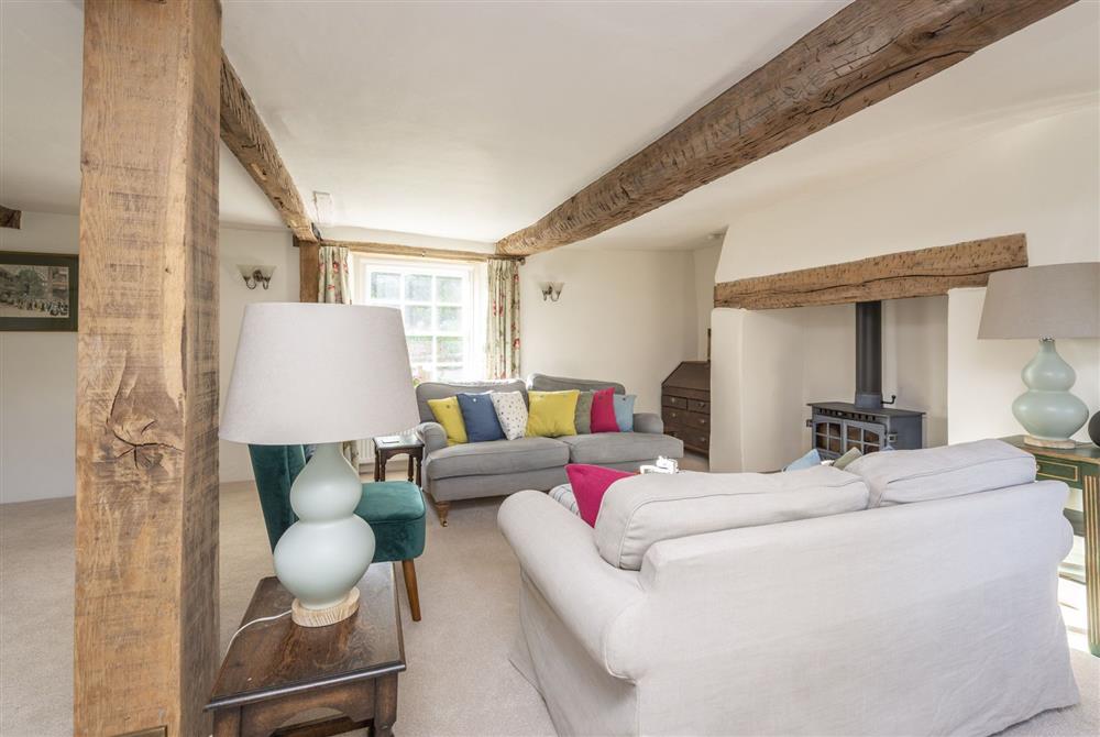 Sitting room with wood burning stove and exposed beams (photo 2) at Kiddles House, Piddletrenthide, nr Dorchester