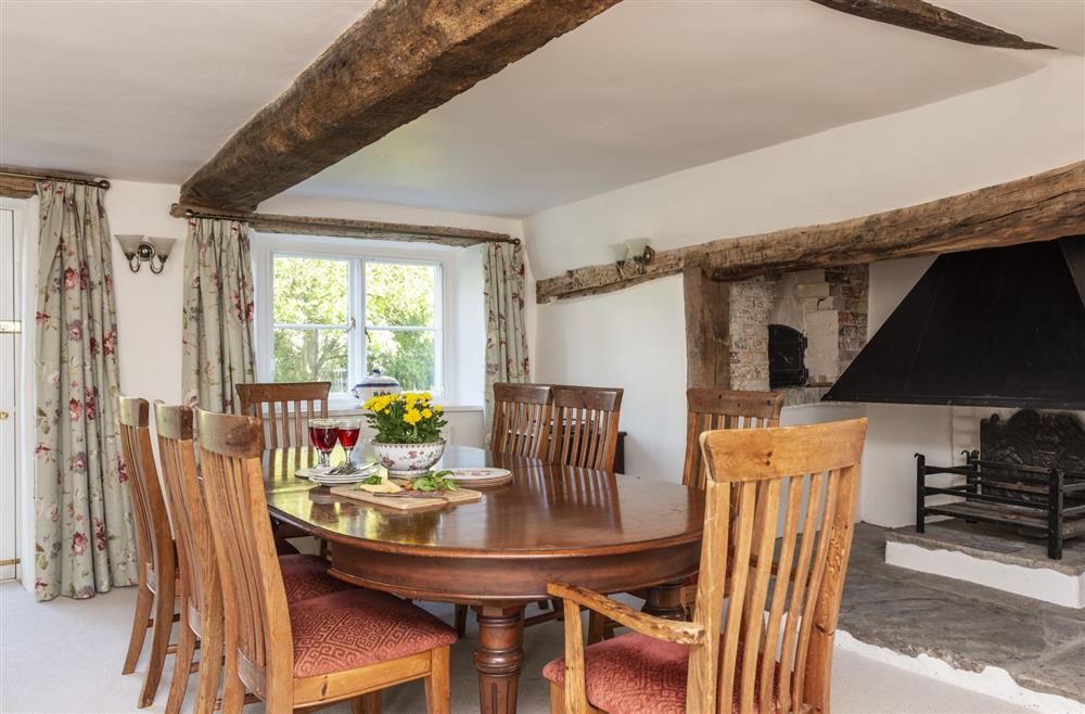 Stunning dining area with feature fireplace at Kiddles House, Piddletrenthide, nr Dorchester