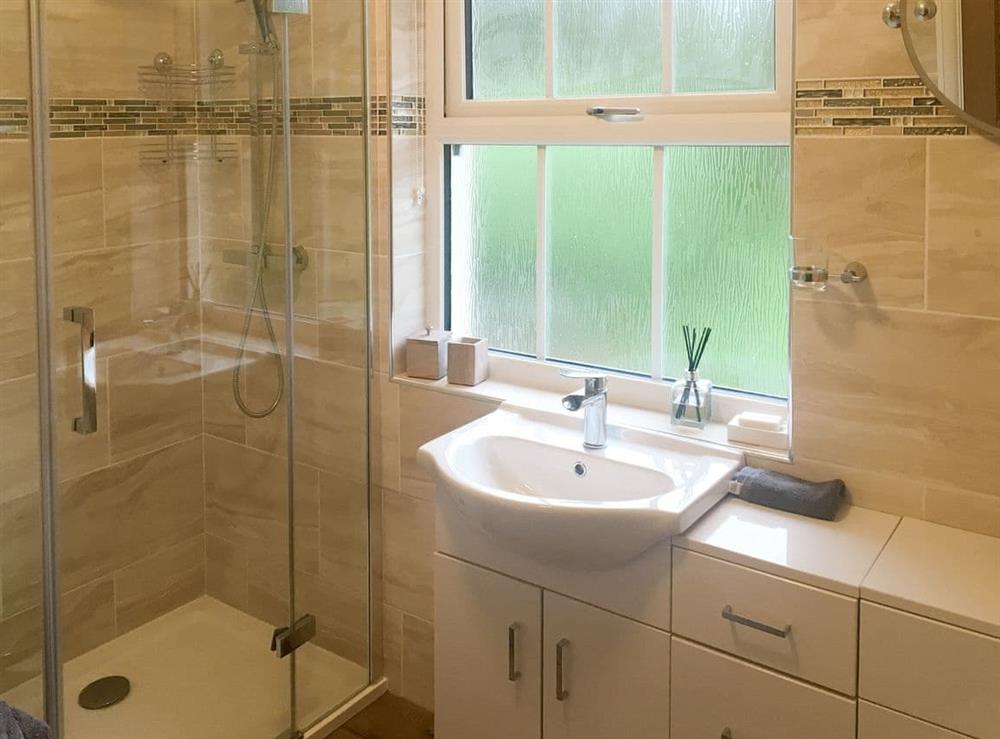 Attractive bathroom with free standing bath and shower cubicle at Kielder Kip Cottage in Kielder, near Bellingham, Northumberland