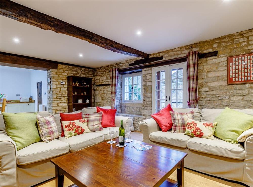 Comfortable seating within living area at Kilcot Coach House in Lower Kilcot, near Wotton-under-Edge, Gloucestershire