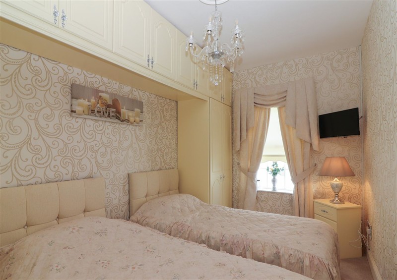 A bedroom in Killelton Cottage at Killelton Cottage, Camp