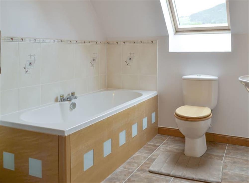 Bathroom with bath and separate shower cubicle at Kilmore House in Drumnadrochit, near Inverness, Inverness-Shire