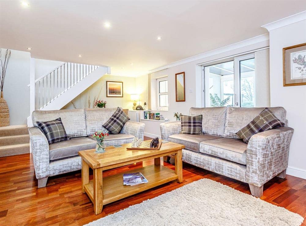 Comfortable seating within living area at The Garden Wing, 