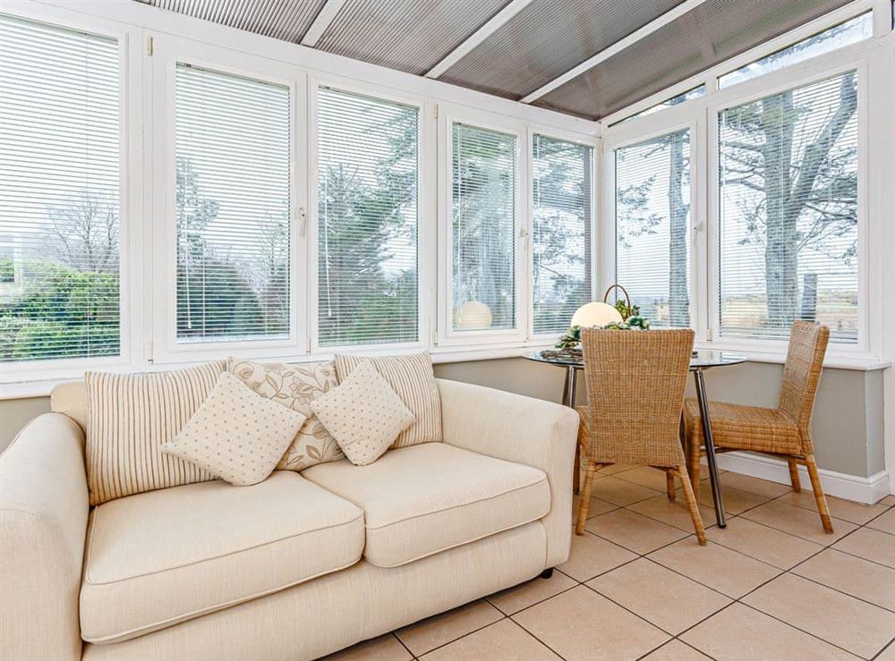 Well-furnished conservatory at The Garden Wing, 
