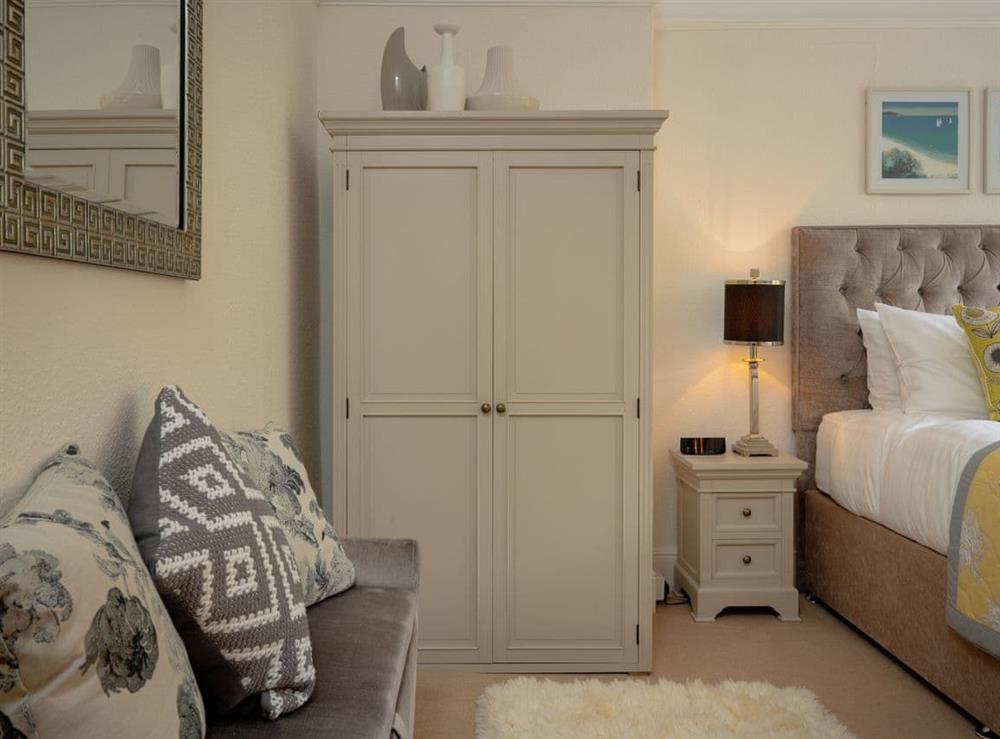 Ample storage within double bedroom at Kinbrae Apartment in Torquay, Devon
