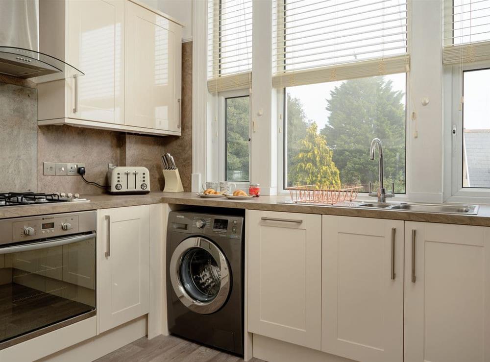 Well-equipped fitted kitchen at Kinbrae Apartment in Torquay, Devon