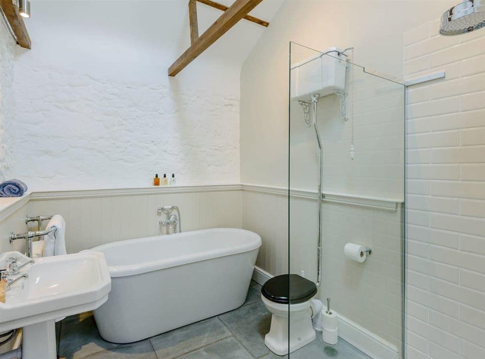 Impressive en-suite with with roll-top bath at The Stables, 