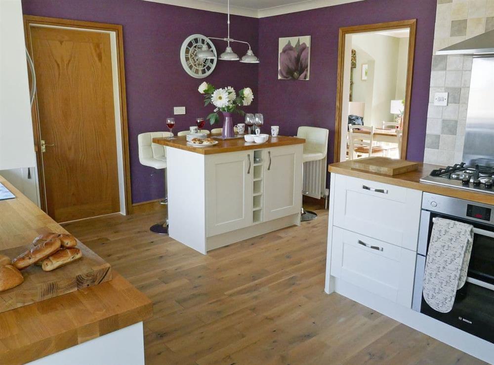Impressive kitchen with breakfast area (photo 4) at Kingfisher Cottage in Amble, Northumberland