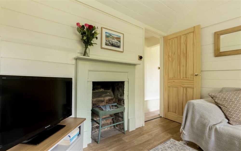 Relax in the living area at Kingfisher Cottage in Burley