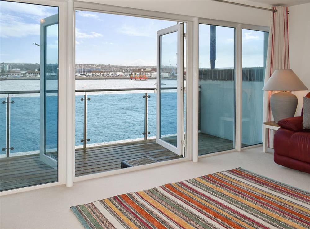 Outstanding views from the living room and balcony at Kings Haven in Mount Batten, near Plymouth, Devon