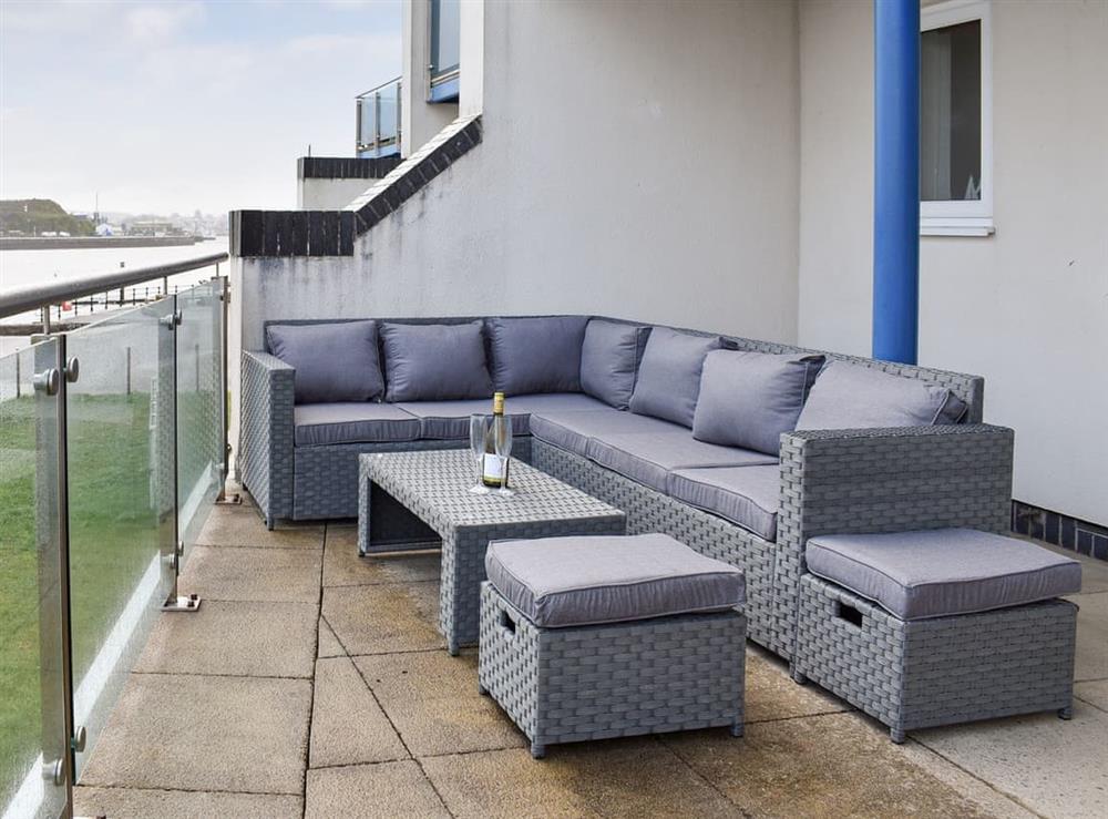Spacious paved terrace with outdoor furniture at Kings Haven in Mount Batten, near Plymouth, Devon