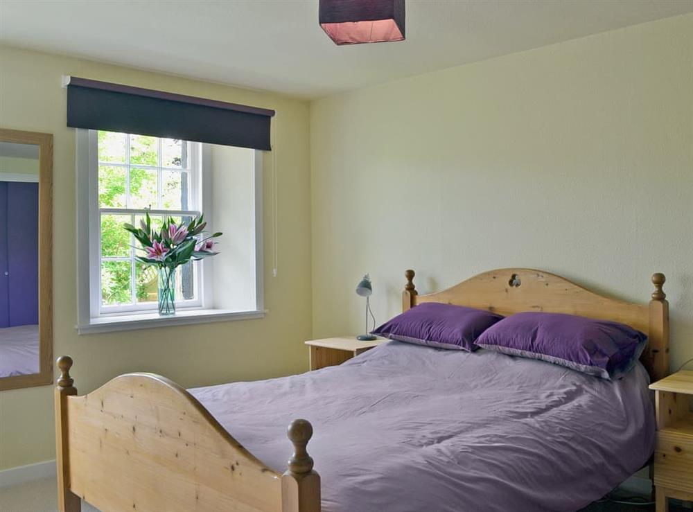 Double bedroom at Kinnettas Cottage in Strathpeffer, Ross-Shire