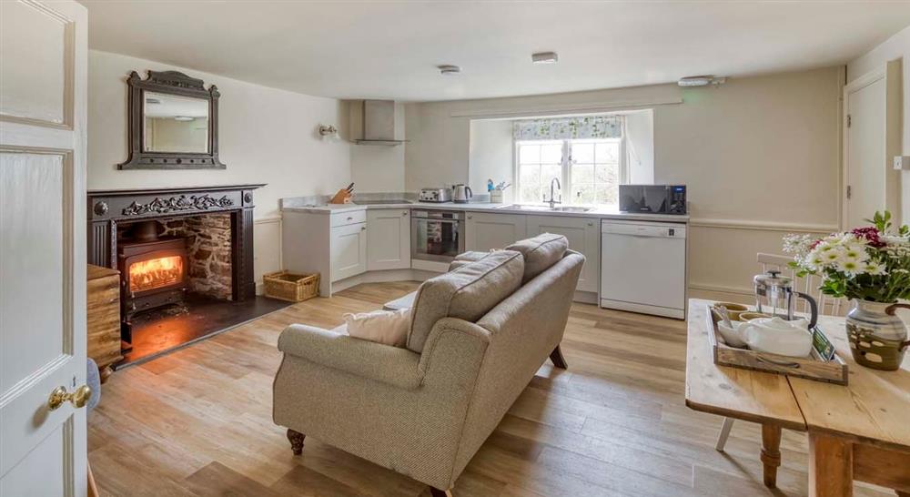 The open plan sitting room, kitchen and dining area at Kipscombe Cottage in Lynton, Devon