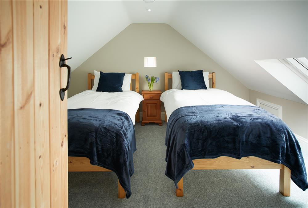 Bedroom two has twin 3’ single beds at Kirby Cottage, Harome
