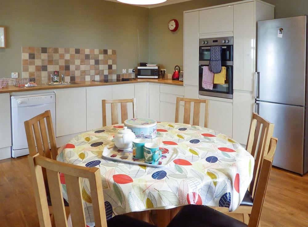 Convenient dining area within kitchen at Kirkbride Farmhouse in Carsluith, near Newton Stewart, Wigtownshire