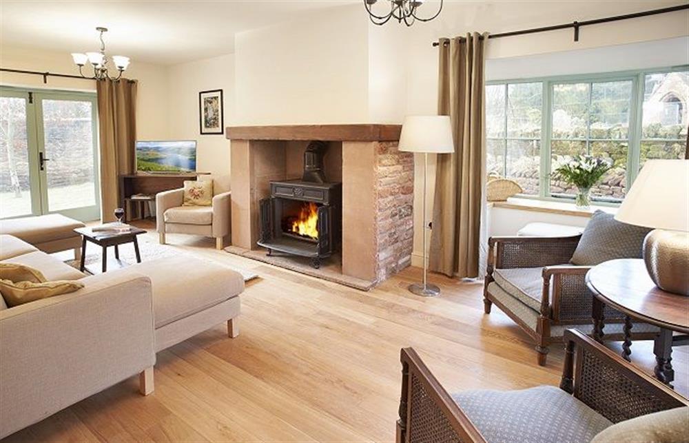 Sitting room with cast iron, wood-burning stove