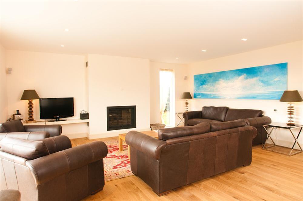 A light and spacious sitting room with comfortable leather sofas, widescreen TV with Sky HD at Kirkdale in Thurlestone, Nr Kingsbridge