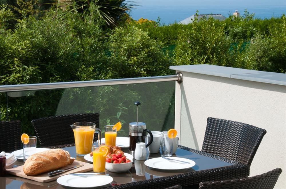 'Breakfast on the terrace' with bench seating and sea views at Kirkdale in Thurlestone, Nr Kingsbridge