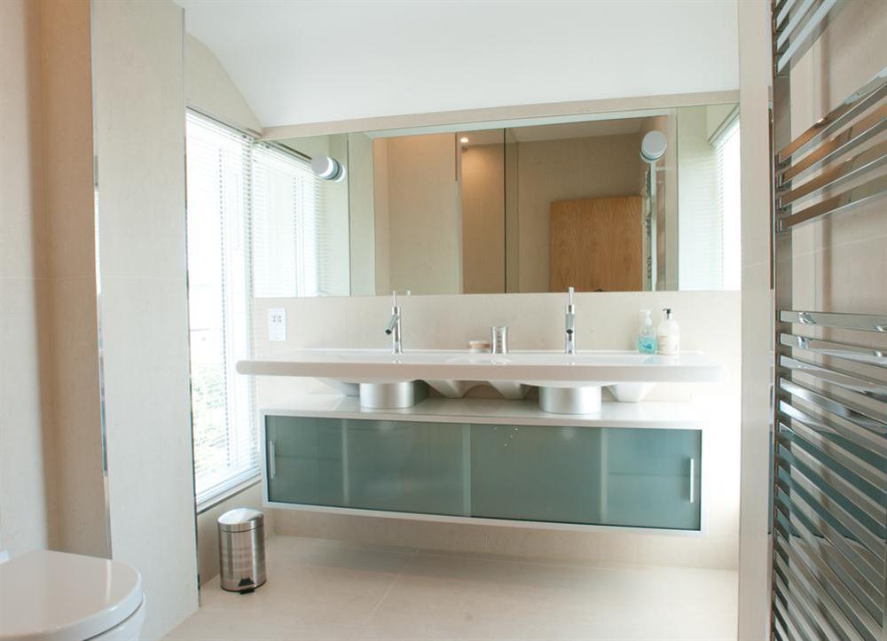 Fully tiled Master en suite bathroom with double vanity unit at Kirkdale in Thurlestone, Nr Kingsbridge