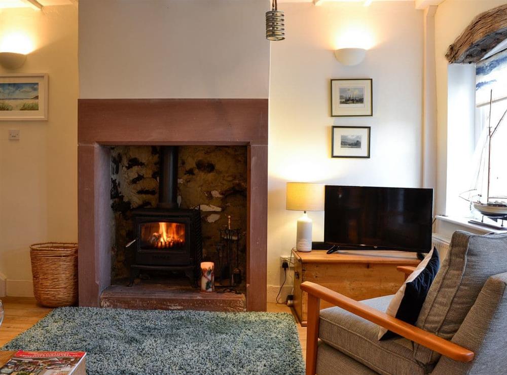 Cosy living room with wood burner (photo 3) at Kirkeway in Allonby, near Maryport, Cumbria