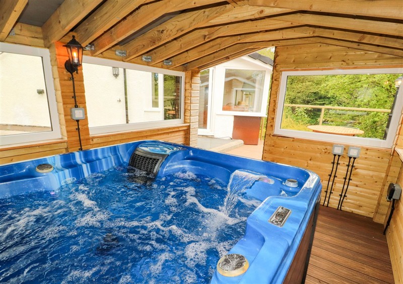 Enjoy the hot tub at Kirkland Howe Cottage, Arlecdon