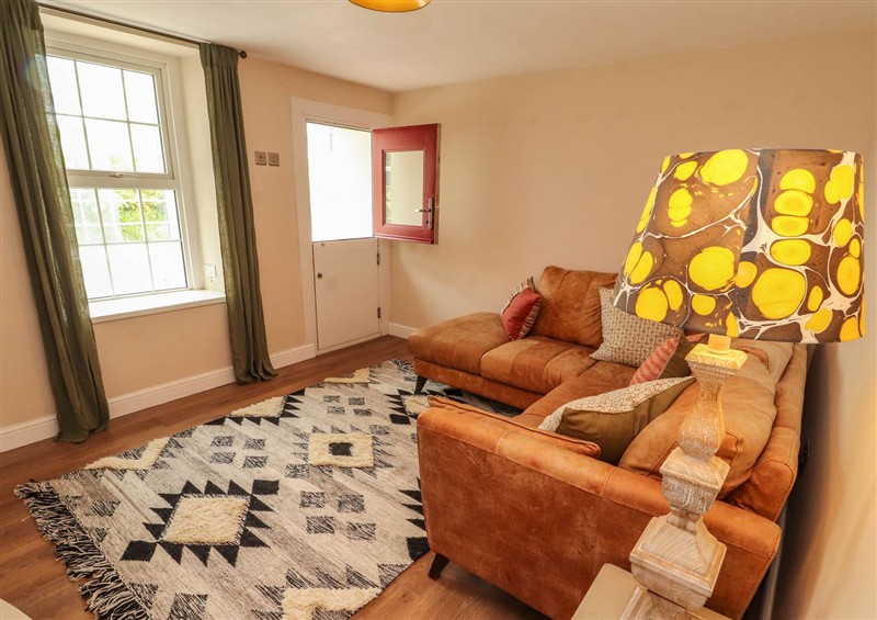 Relax in the living area at Kirkland Howe Cottage, Arlecdon