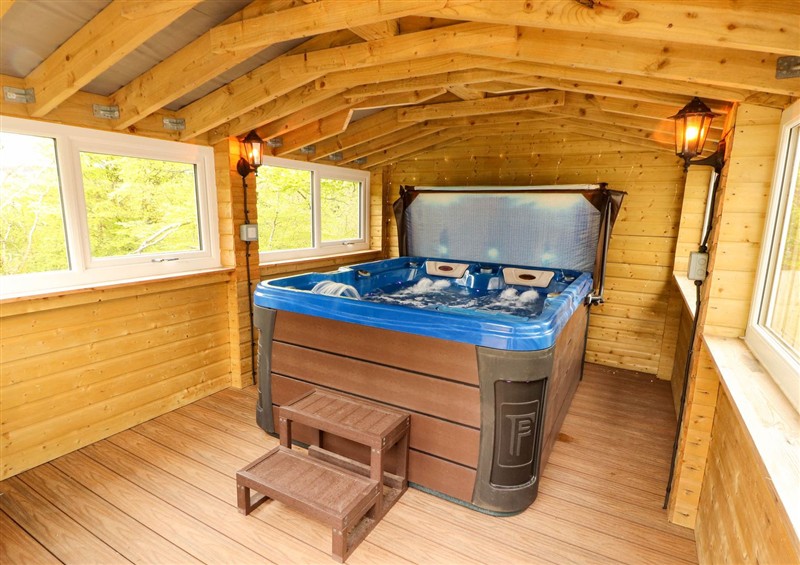 Spend some time in the hot tub at Kirkland Howe Cottage, Arlecdon
