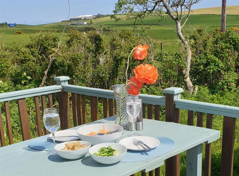 Outdoor eating area at Kirklauchline Cottage in Stoneykirk, near Portpatrick, Wigtownshire