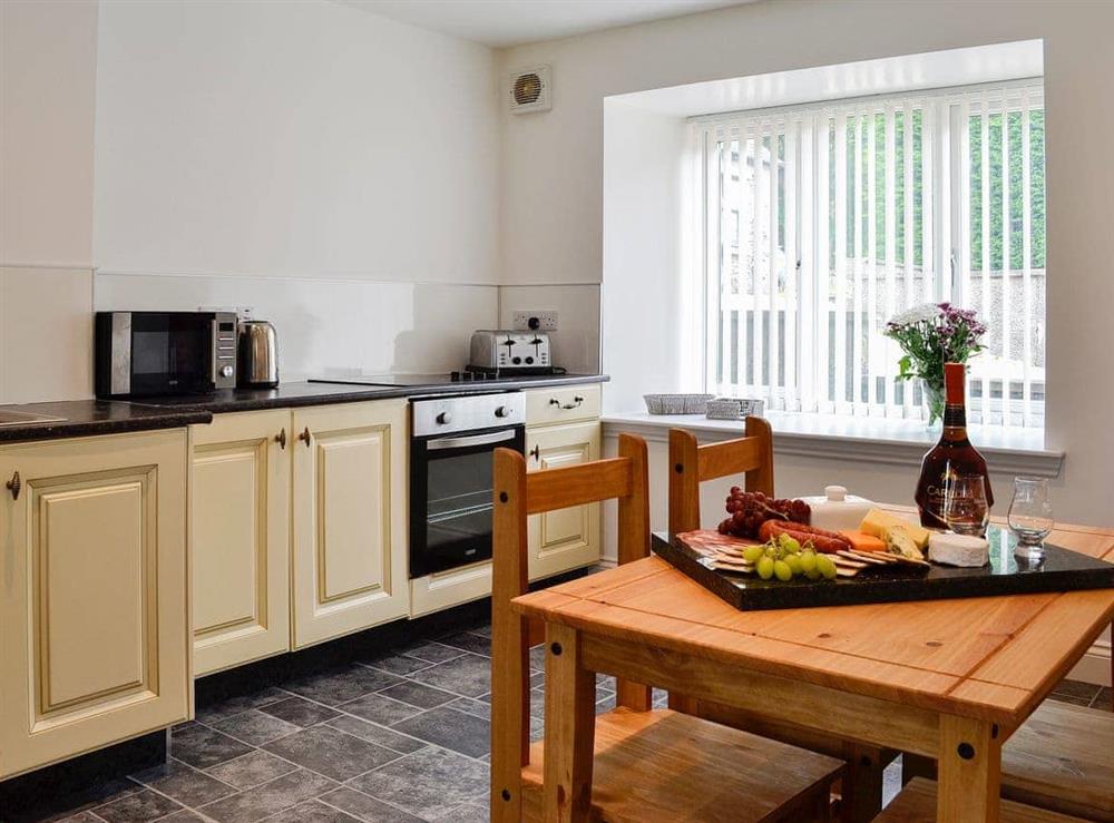 Spacious kitchen with attractive dining area at Kirroughtree Steading in Newton Stewart, Dumfries and Galloway, Wigtownshire