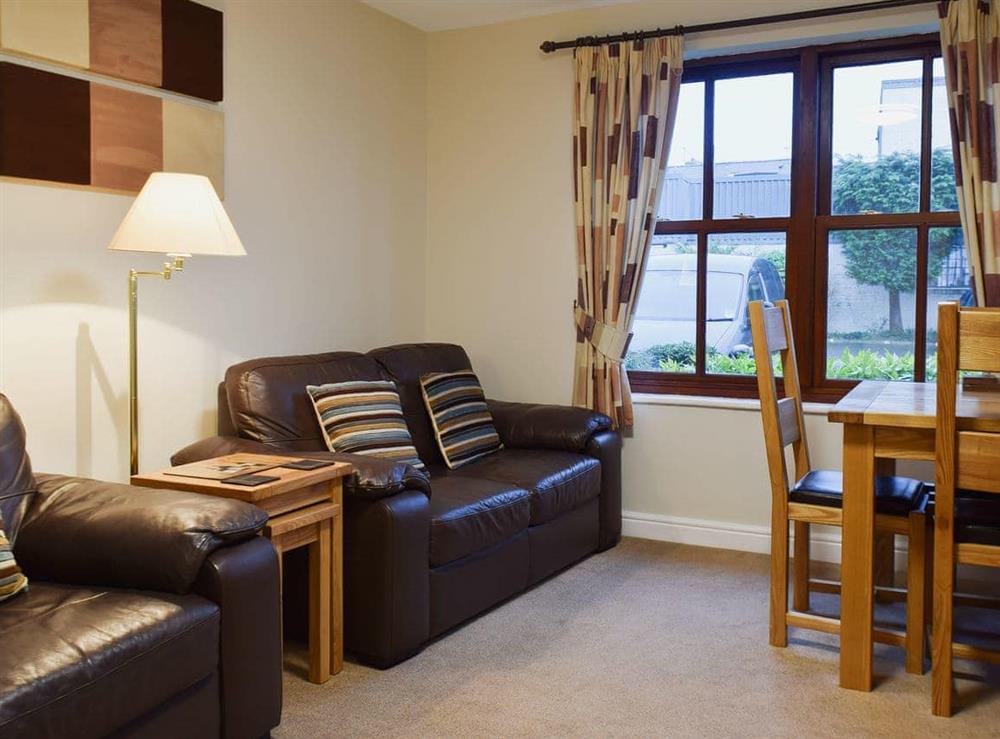 Cosy living room with dining area at Hewetson Court, 