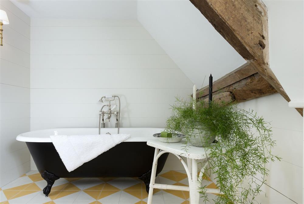 Bathroom with roll-top bath at Kitchen Garden Cottage, Moreton-in-Marsh