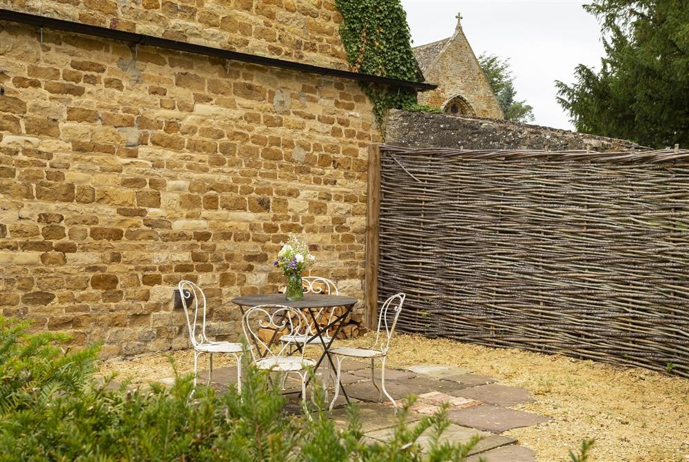 Pretty patio seating four guests at Kitchen Garden Cottage, Moreton-in-Marsh