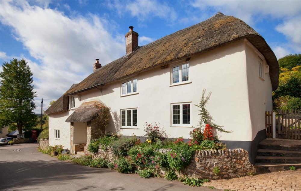Kites Holt, an historic semi-detached cottage with parking for one car to the side of the property at Kites Holt, Stockland