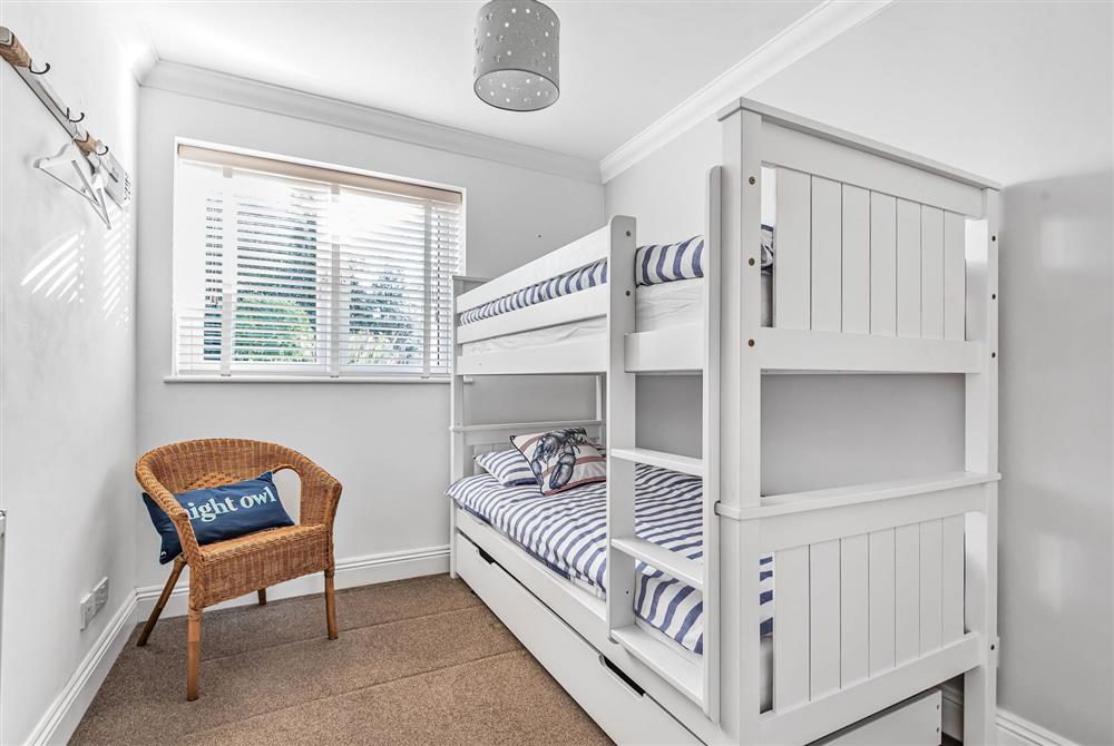 Kittiwake, Dorset: Bedroom four with full size bunk beds at Kittiwake, Highcliffe-on-Sea, Dorset