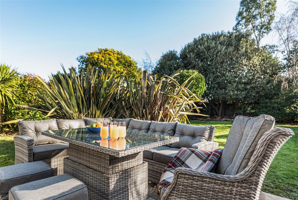 The garden seating area is perfect for al fresco dining at Kittiwake, Highcliffe-on-Sea, Dorset