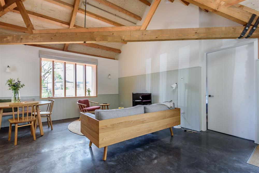 Sitting and dining area with exposed beams throughout at Kittwhistle, Dorchester