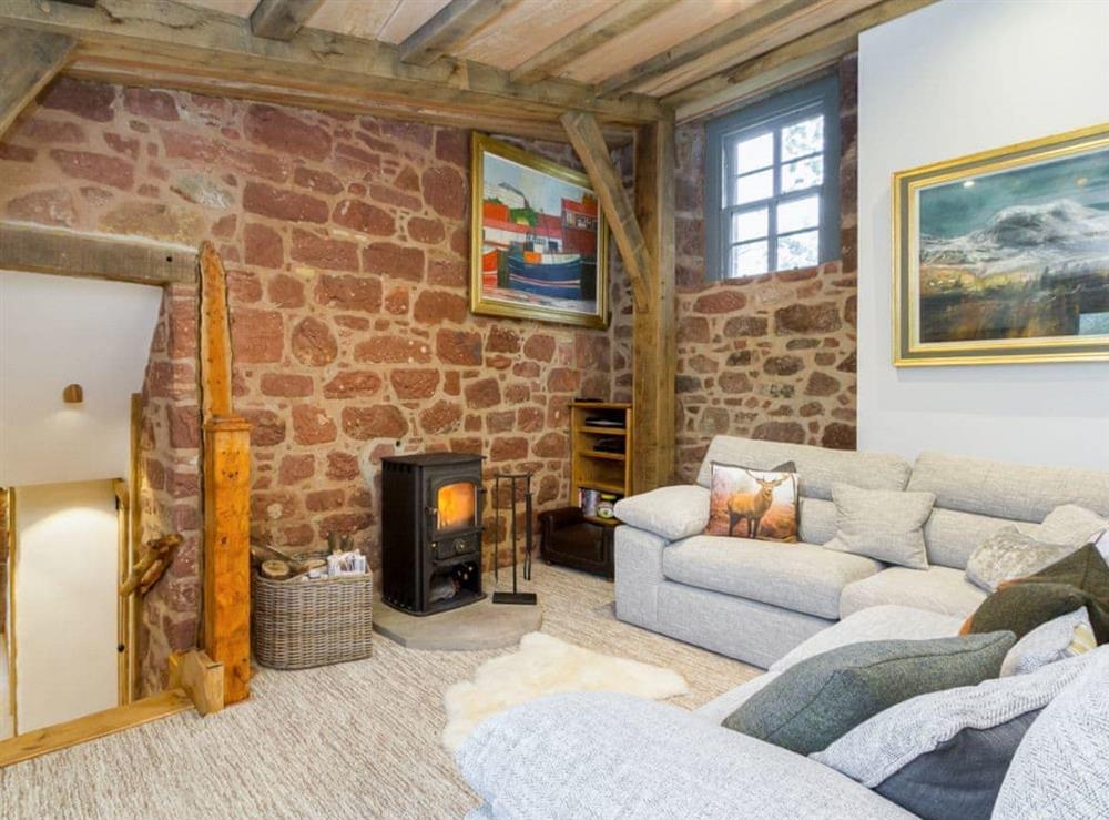 Lounge with wood burning stove at Knock Old Castle in Largs, Ayrshire