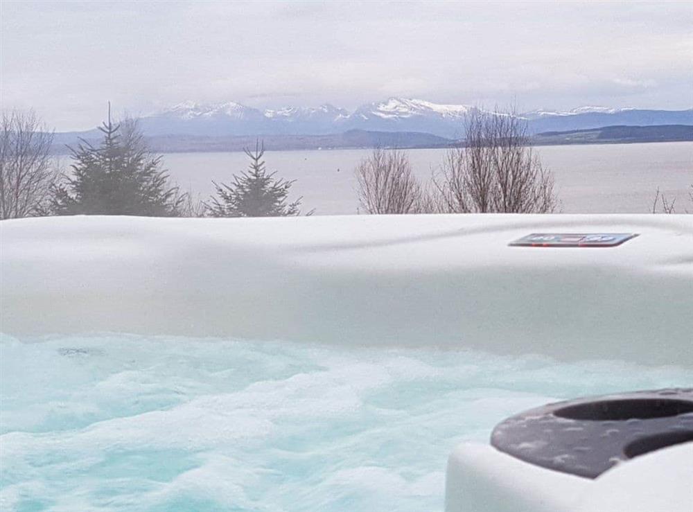 Relax and admire the view from the private hot tub at Knock Old Castle in Largs, Ayrshire