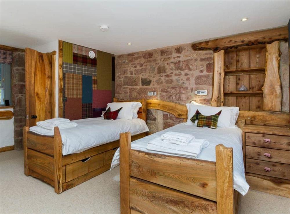 Twin bedroom with stone walls & en-suite at Knock Old Castle in Largs, Ayrshire