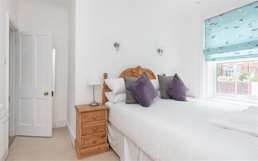 Bright bedroom one with 5ft king size bed. at Knott Cottage in Dartmouth