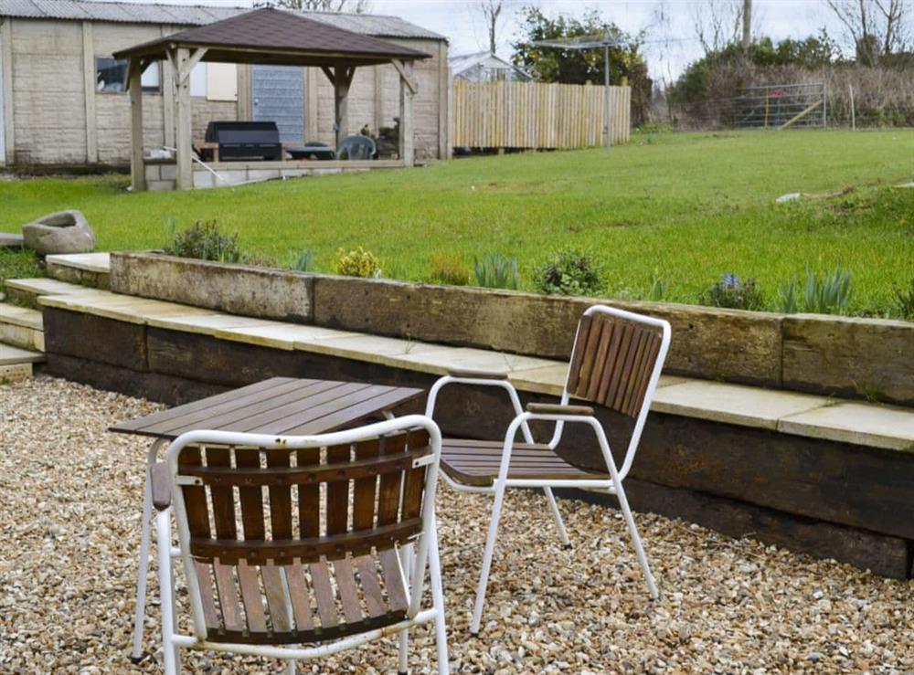 Large garden with patio, garden furniture and gas barbecue (photo 2) at Knotty Corner Cottage in Fairy Cross, near Bideford, Devon