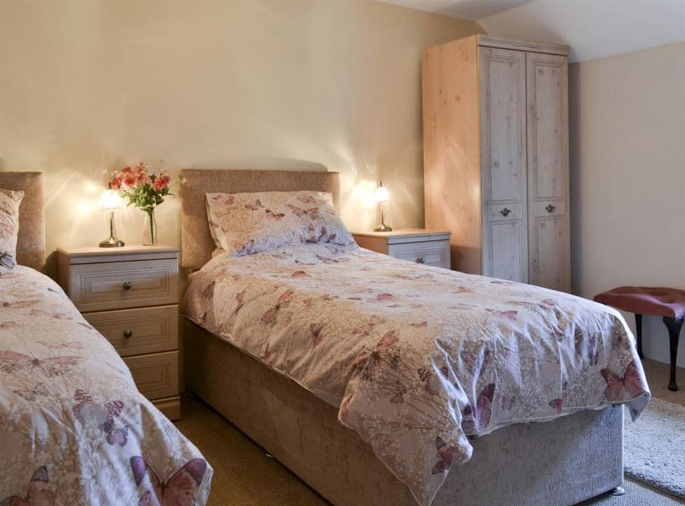 Twin bedroom at Knotty Corner Cottage in Fairy Cross, near Bideford, Devon