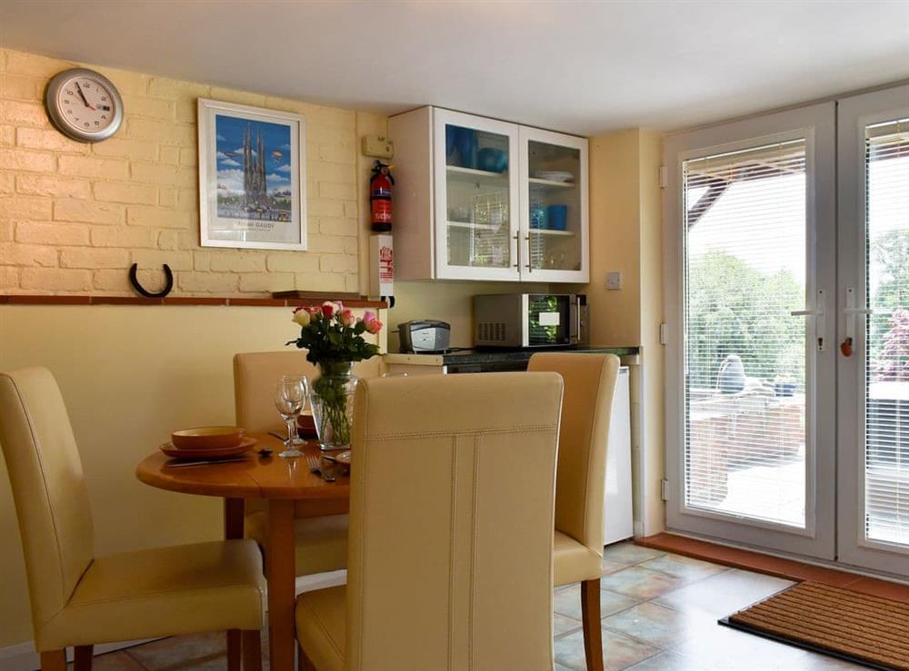 Dining area at Knowle Croft Cottage in Fairlight, near Hastings, East Sussex