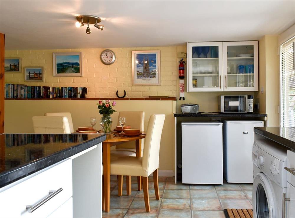 Kitchen and dining area at Knowle Croft Cottage in Fairlight, near Hastings, East Sussex