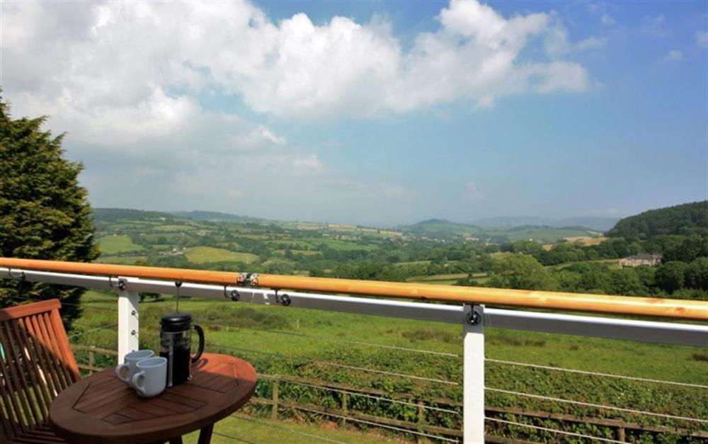 Balcony views across the Marshwood Vale at Kowhai Cottage in Charmouth