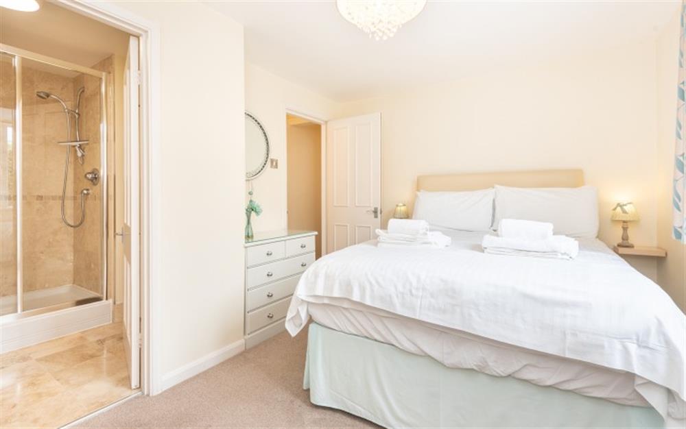 Master bedroom with ensuite at La Casa Apartment in Lyme Regis