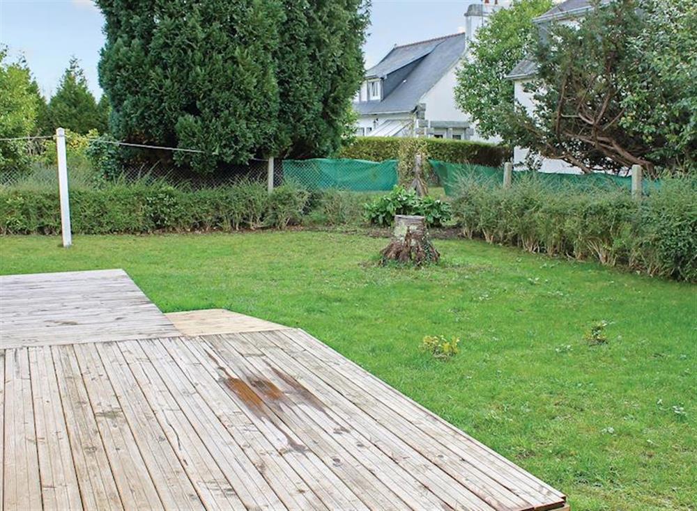 Lawned garden and decked area at La Maison Blanche in Bénodet, Brittany, France