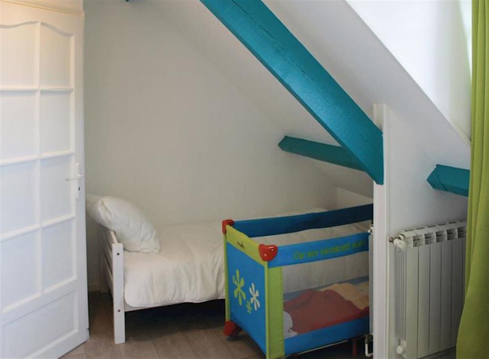 Single bedroom with child’s bed and cot at La Maison Blanche in Bénodet, Brittany, France