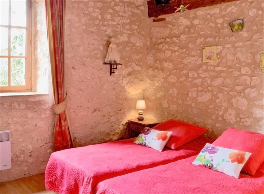 Twin bedroom at La Mijotiere in Thénac, Dordogne, France